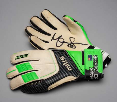 Mark Schwarzer signed Australia Mitre goalkeeper's gloves,
 white, green and black gloves printed MARK SCHWARZER, each palm signed in black marker pen