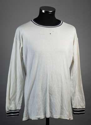 White Bolton Wanderers no.9 jersey, lates 1960s, 
 Bukta, long-sleeved with blue hoops to crew neck collar and cuffs, reverse numbered 9 

  Some smal