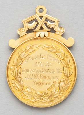F.A. Cup winner's medal awarded to Newcastle United's trainer J.Q. McPherson,1931-32,
 obverse with shield crest flanked by two footballers, reverse e