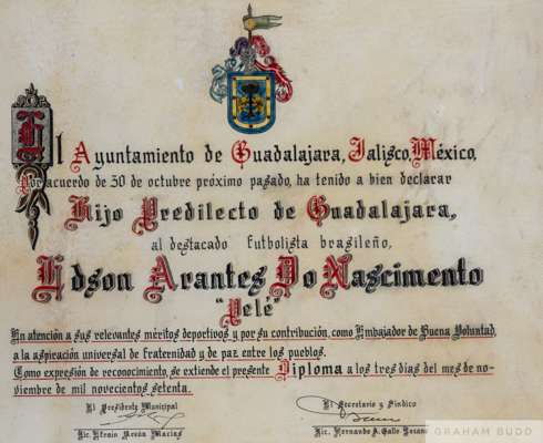A framed certificate of merit, hand drawn on vellum, presented to Pelé, 
 in recognition of his skills as a football player by the city of Guadalajara