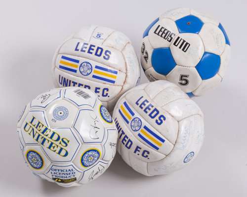 Four Leeds United autographed footballs, 1990s