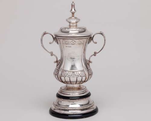 A silver scale-replica of the F.A. Cup trophy