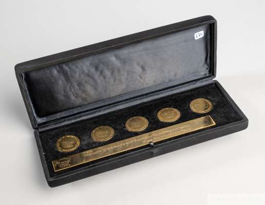 A coin set presented to Pelé consisting of a satin presentation box 
 housing five gold tone coins lined up to form the number "10,000" along with a g
