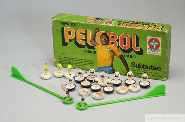 A box with players from the Subbuteo game, "Pelebol,"
  given to Pelé. Subbuteo, an English company established in 1946, produces tabletop games simul