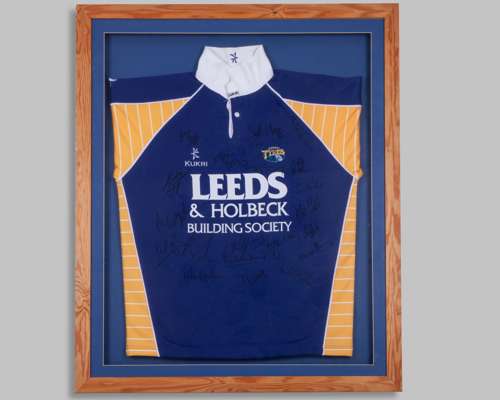 A blue and yellow Leeds Tykes autographed shirt
