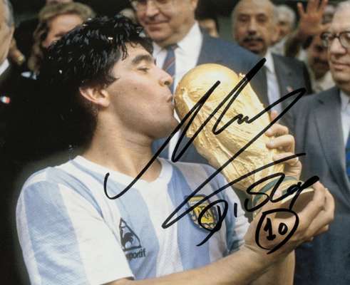 Diego Maradona signed photograph,
 7 by 9in. colour portraying Maradona kissing the World Cup Trophy at the 1986 World Cup, signature in black marker