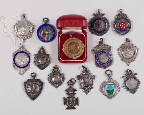 A collection of twelve silver medals