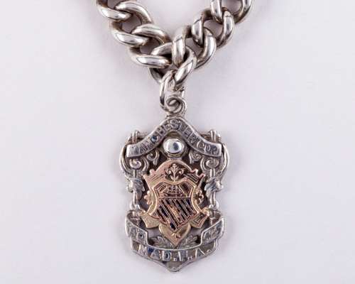 A 9ct gold and silver Manchester Cup runners-up medal, 1904-05