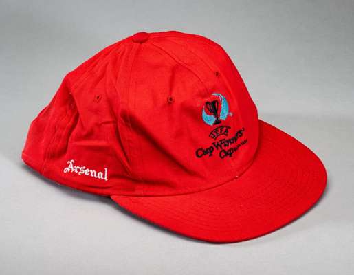 Arsenal red UEFA Cup Winners' Cup baseball cap worn by Ray Parlour, 
 red cap embroidered UEFA CUP WINNERS' CUP and emblem on the front, embroidered A