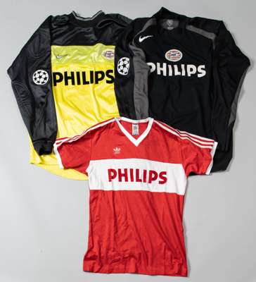 Three PSV Eindhoven match jerseys,
 comprising red no.5 believed to have been worn by Soren Lerby; Patrick Lodewijks yellow and black no.20 goalkeepin