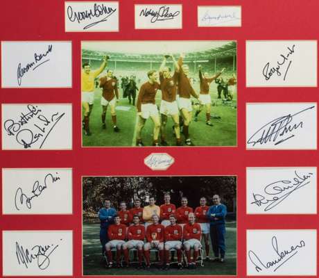 A 1966 World Cup framed presentation signed by the Alf Ramsey and the 11 England winners, the signatures of Moore & Ramsey in ink, the others in black