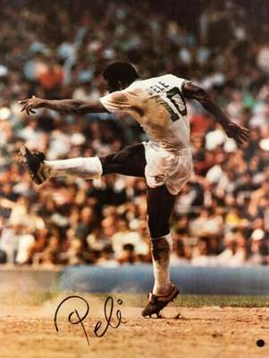 Pele signed large and impressive colour New York Cosmos photograph,
 38 by 29in. (97 by 74cm.), signed boldly in black marker pen, action photograph p