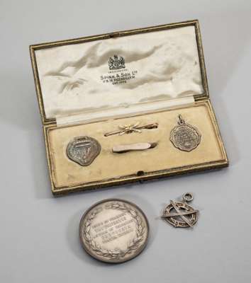 Wimbledon Skating Club silver medal 
 in original fitted case, the lid with gilt-tooled lettering M. Ll. P., Badges of the Asking Club, The Wimbledon 