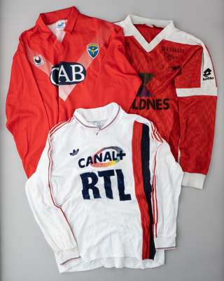 Three Continental clubs match jerseys,
 comprising a white PSG no.9 away unnamed  jersey, with Canal + RTL sponsor logo; red Calcio Brescia no.15 jers