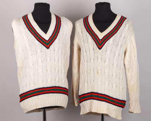Green, red and navy long-sleeved and sleeveless cricket sweaters