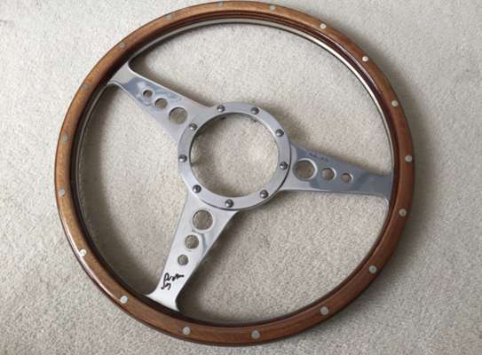 Stirling Moss signed wooden Moto Lita steering wheel,  

This steering wheel is a contemporary manufacture of an original 1950’s design, hand made by 