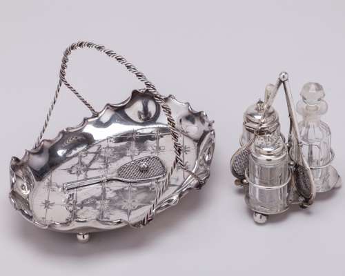 A white-metal tennis cruet set