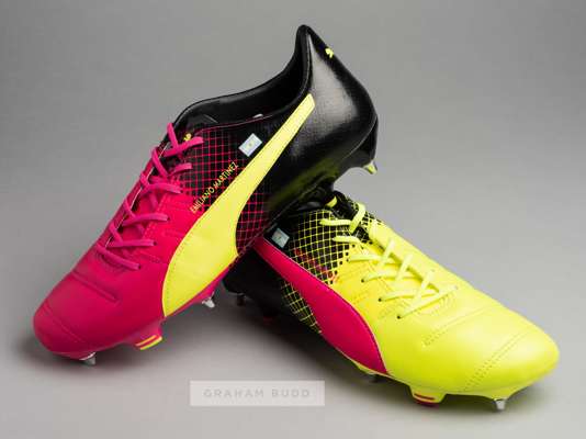 Arsenal and Argentina's Emiliano Martinez Puma Evopower football boots,
 yellow, black and pink football boots each embroidered with EMILIANO MARTINEZ