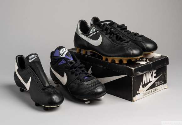 Pairs of vintage Nike Eurostar football boots, 
 size 5 1/2, black and silver, model 17712, in original box, unworn condition and two single Nike foot