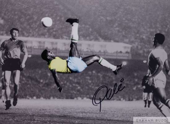 A large colour and black and white portrait photograph of Pele, 
 signed in black marker pen on the front by Pele and accompanied by a certificate of 