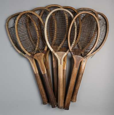 A collection of 14 wooden framed convex-wedge tennis racquets,
 various dates and conditions, (14)