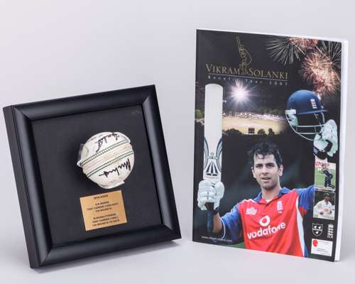 Shane Warne and Muttiah Muralitharan autographed Kookaburra cricket ball display