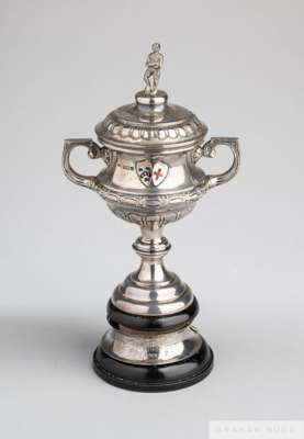 Tom Wilson silver and enamel 1924-25 Huddersfield Infirmary & Victoria Nurses Hospital Cup
 the two-handled trophy cup surmounted by a figure of a foo