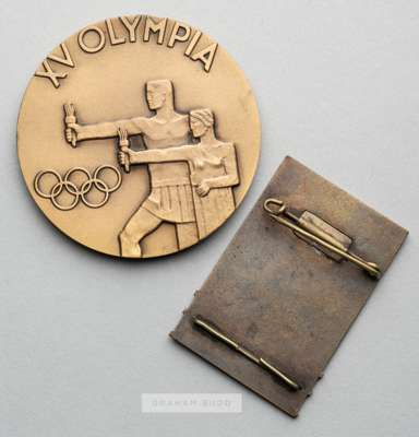 Helsinki 1952 Olympic Games participant's medal,
 designed by K Rasanen, bronze, obverse with stylised heads over the Olympic Stadium, inscribed HELSI