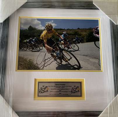 Chris Froome (UK) signed Tour De France winning 8 by 10in. action photograph,
 professionally framed / glazed with double mattes and plaque on Froome’