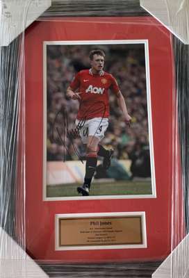 Manchester United collection of six signed/framed 8 by 10in. photographs of former players, 
 including Phil Jones (53 by 47cm), Alex Buttner (35 by 4