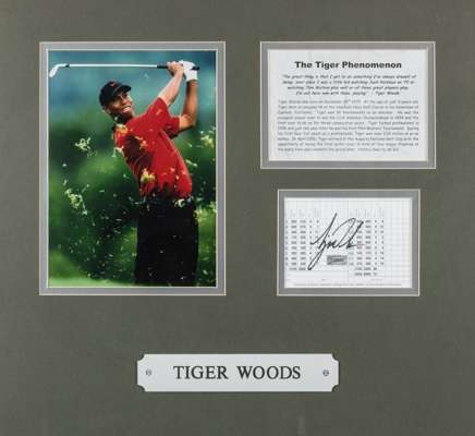 Tiger Woods 2001 Augusta National golf display,
 featuring a 11 by 8in. colour action photograph of Tiger Woods mounted beside a signed Augusta Nation