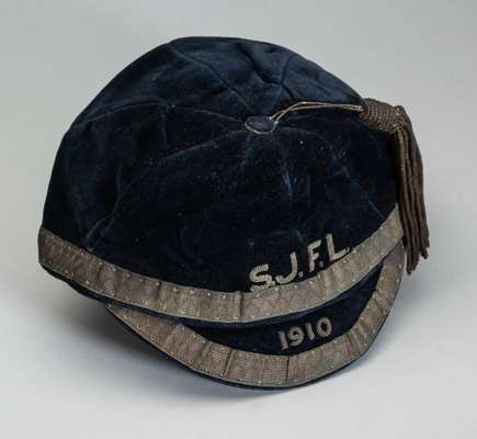 Two international football caps,
 a Scottish Junior Football League representative cap, 1910, navy velvet cap with gilt braiding and tassel, embroider
