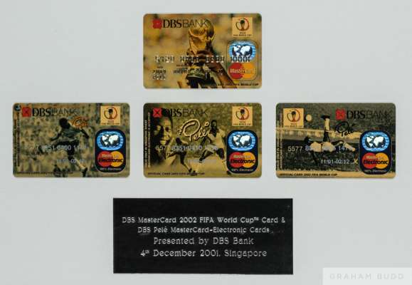 A framed set of four official 2002 FIFA World Cup DBS Bank MasterCard credit cards decorated primarily with images of Pelé
 Includes an engraved prese