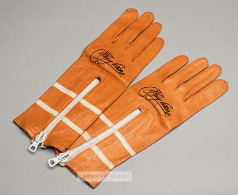 Barry Sheene signed vintage racing gloves,
 British Made, orange leather gloves featuring two white bands, signed in black marker pen
