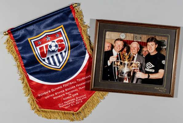 Sir Alex Ferguson, Sir Matt Busby and Denis Irwin colour photograph with the FA Premier League trophy, circa May 1993,
 mounted, glazed and framed, ov