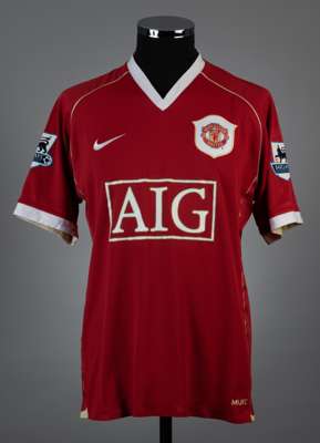 Cristiano Ronaldo red and white No.7 Manchester United match worn short-sleeved jersey, 2006-07, 
 Nike, L, with v-neck collar and embroidered cloth b