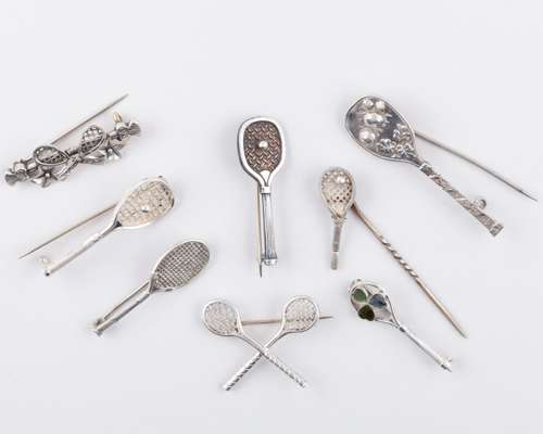 Two silver tennis related brooches, 1893 and 1895
