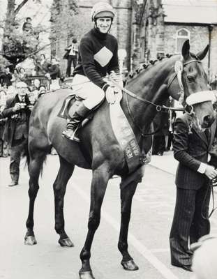 A trio of framed photographs featuring the racehorse ''Red Rum'' all signed to the backboard by the trainer 'Ginger' McCain, each a 15 by 12in. b&w, t