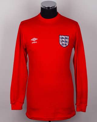 Nobby Stiles red No.4 England v. West Germany commemorative match long-sleeved shirt, 1985