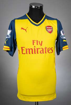 Lukas Podolski yellow no.9 Arsenal away jersey season 2014-15 from the game v Aston Villa that took place on 20/9/14 at 
 Villa Park,
 Player issued s
