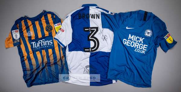 Three Skybet League One players' jerseys,
 comprising Lee Brown signed white and blue Bristol Rovers no.3 jersey, season 2016-17, short-sleeved with S