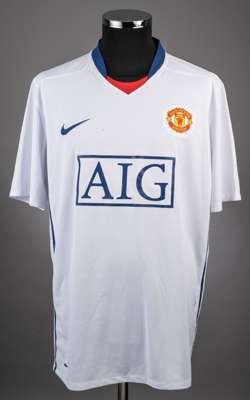 Ronaldo autographed white, red and blue No.7 Manchester United short-sleeved jersey, 
 with v-neck collar, the reverse dedicated and autographed To Ad