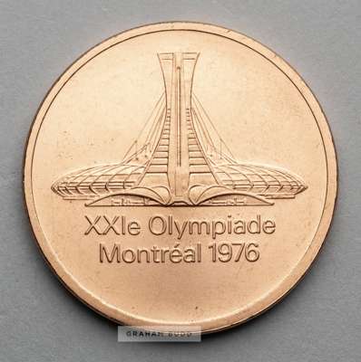 Montreal 1976 Olympic Games participant's medal,
 designed by G. Huel and P. Pelletier, copper, obverse depicting Olympic Stadium above French legend 