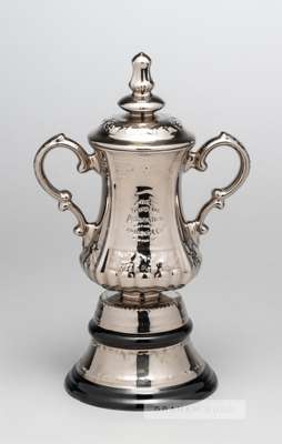 A ceramic miniature replica of the F.A. Cup trophy circa 1950s,
 twin handled with impressed lettering, knopped lid and circular stand, markers stamp 