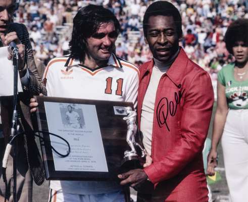 Pele signed colour photographic print receiving The Greatest Soccer Player in the World award from George Best at the Rose Bowl, Los Angeles, 9th Apri