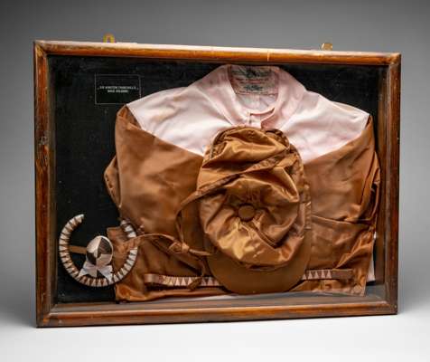 1970s reproduction racing silks shop display in the colours of Sir Winston Churchill,
 comprising sanitised cotton chocolate and pink jacket bearing m