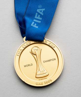 2009 FIFA Club World Cup winner's medal,
 recipient unknown, gilt metal medal, obverse with trophy in relief and FIFA CLUB WORLD CUP WORLD CHAMPION UA