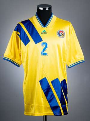 Dan Petrescu, yellow and blue Romania no.2 home jersey, circa 1992-93,
 Adidas, short-sleeved with national emblem, front and reverse numbered 2, no s