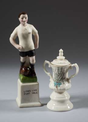 Two ceramic football souvenirs,
 the first a miniature replica of the F.A. Cup trophy by One and All, decorated with heather and inscribed LUCKY WHITE