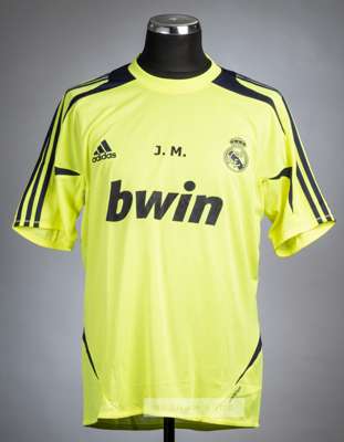 Jose Mourinho yellow Real Madrid training t-shirt, season 2010-11,
 Adidas, short-sleeved with embroidered club crest and J.M. printed on the front, r